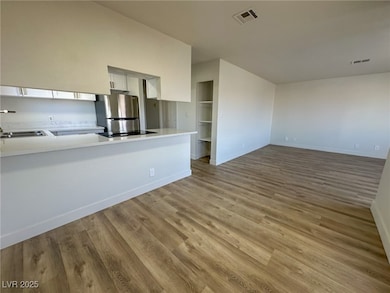 Unfurnished living room with wood finished floors