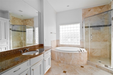 a view of the Primary Bath. Gorgeous traditional design, two closets and tons of natural light