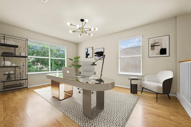 Home office with light wood-style floors, healthy