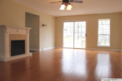 Hardwood Flooring and doors leading to the large back deck