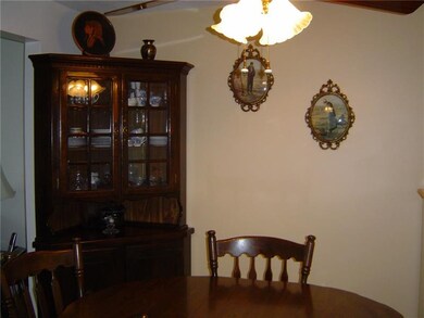 Ceiling fan and light brighten eating area.