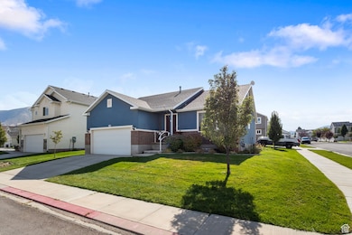 View of front of home with a residential view, concrete driveway, a front lawn, a garage, and stucco siding