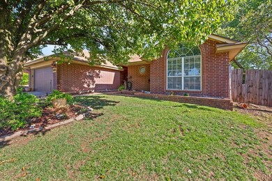Single story home featuring a garage and a front l