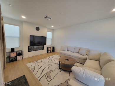 Living area featuring light wood-style flooring, r