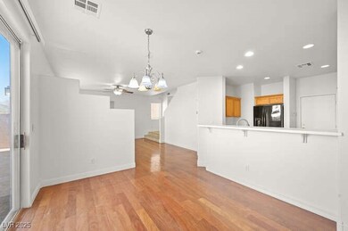 Unfurnished living room with baseboards, light woo