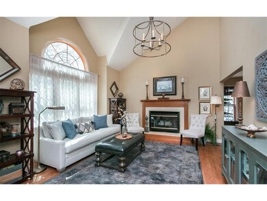 Bright and welcoming cathedral ceiling living room