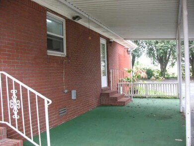 Covered patio at rear of home