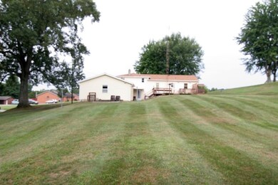 This almost acre lot sits on the edge of town with