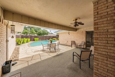View of patio featuring ceiling fan and a fenced i