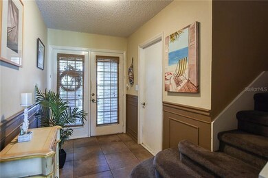 Double door entry leading to the downstairs foyer.