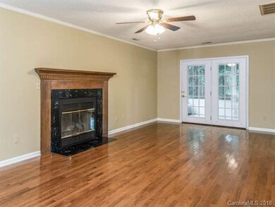 Living room with wood burning fireplace