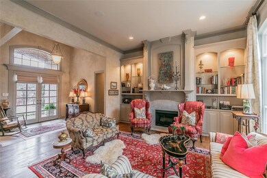 The gas fireplace and lighted built-in cabinetry are the focal points of the formal living