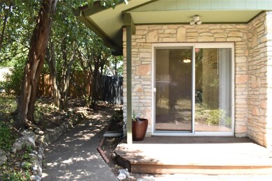 Entrance to property with stone siding