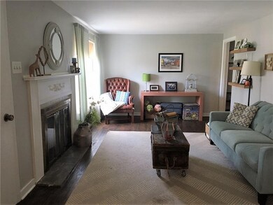 Living area greets you with hardwood flooring and 