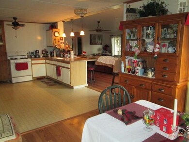 FLOOR PLAN FLOWS FROM LIVING ROOM TO KITCHEN AND D