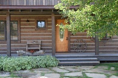 Front porch and front door.  Great view of the fir