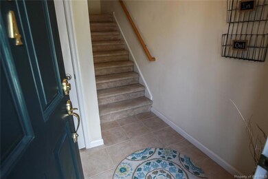 Downstairs entry with stairs leading up to your ho