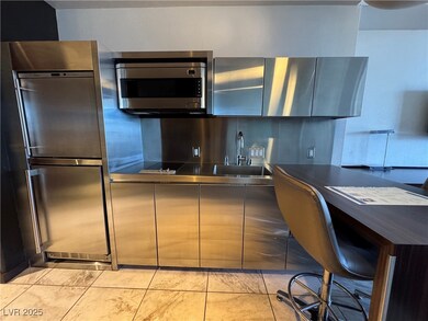 Kitchen with dark countertops, stainless steel mic
