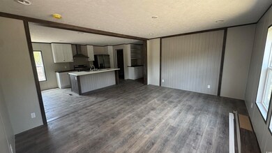 Kitchen with wall chimney range hood, dark wood-ty