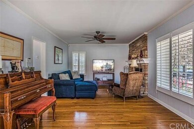 Living room view#2. Custom shutters and ceiling fa