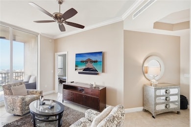 Living area with ornamental molding, baseboards, c