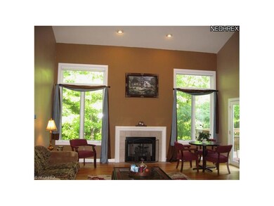 The living room feels expansive with cathedral cei