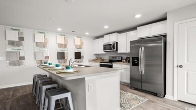 Kitchen with a breakfast bar, appliances with stai