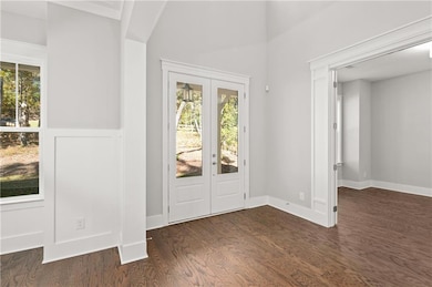 View of foyer and study as seen from the dining room.  Not that the study will have double French doors so you can work in peace.