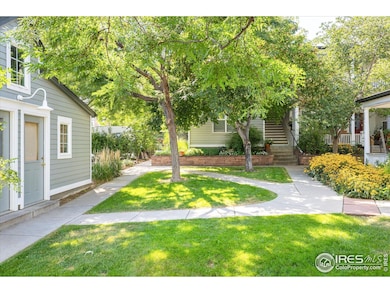 lush, flower-filled courtyard creates a welcoming entry
