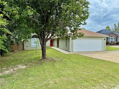 View of front of property featuring a garage, a fr