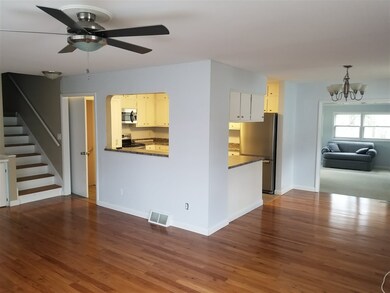 Kitchen inside walled area; family room is to back