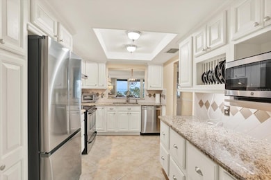 Custom cabinets with a plate holder and pull-out pantry drawers for easy access.