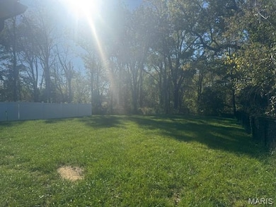 View of fenced backyard