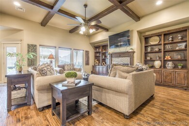 Stunning living with high beamed ceilings, stone f