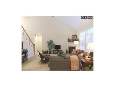 The spacious great room features soaring ceilings,