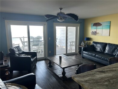 Living room featuring a ceiling fan and wood finished floors