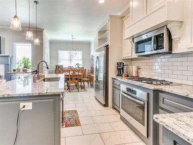 Kitchen featuring appliances with stainless steel 