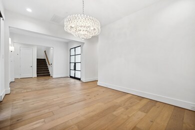Formal dining room just off the entry showcases wa