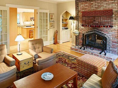 Living Room. Moorish fireplace is shared with the 