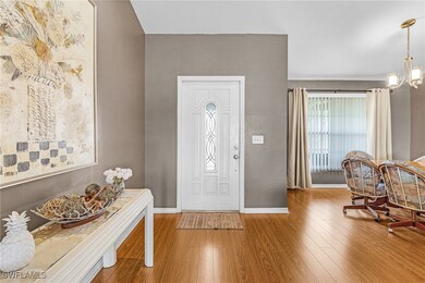 Entryway featuring wood finished floors and a chan