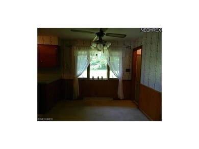 Formal Dining Room w/bead-board trim, carpet over 
