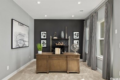 Office area featuring light carpet and recessed lighting