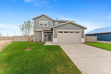 Traditional home featuring concrete driveway and an attached garage