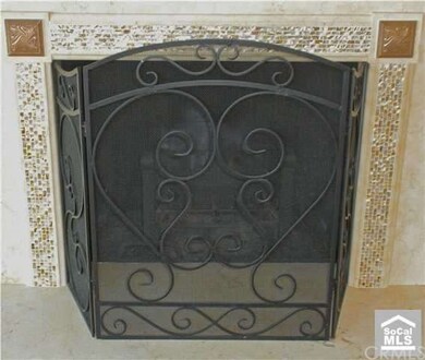 ROMANTIC FIREPLACE...TRAVERTINE FACED AND FRAMED W