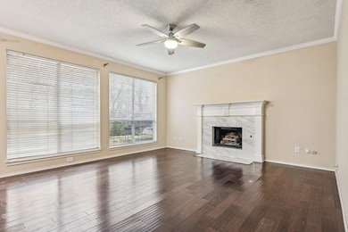 Unfurnished living room with a premium fireplace, 