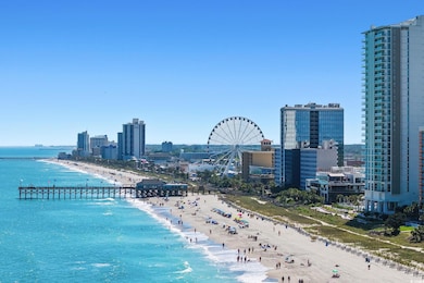 Water view featuring local beach and city skyline