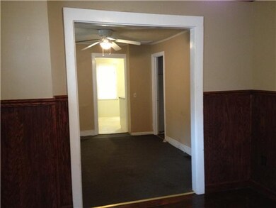 Living Room. Looking from living room out to kitch