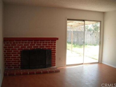 Fireplace in Living Room, sliding door to sideyard