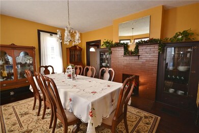 Built-in cabinets and brick fireplace in the dinin