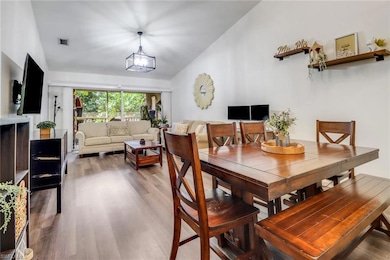 Dining area featuring an inviting chandelier, visi